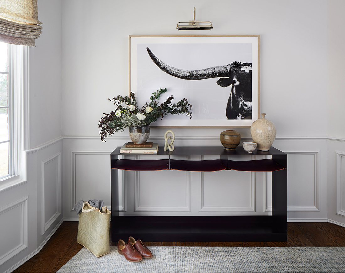 console-table-with-bull-photograph